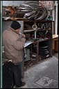 Bicycle mechanic in Shanghai alley.