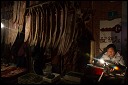 Keymaker, drying fish, Friday night market, Shanghai, China.