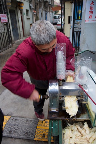 Sugar cane juicemaker, Shanghai, China.