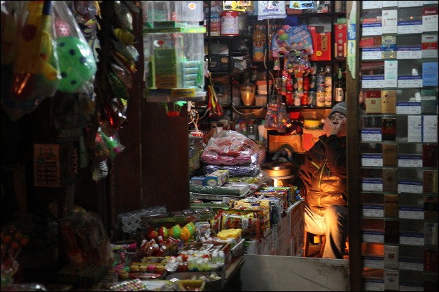 Shopkeeper, Shanghai, China.