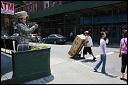 Pushing produce down the street. Little Italy, NYC.