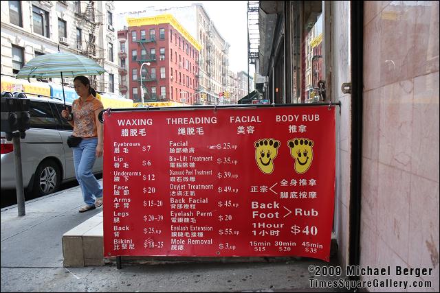 Body services offered on a hot summer day. Chinatown, NYC.