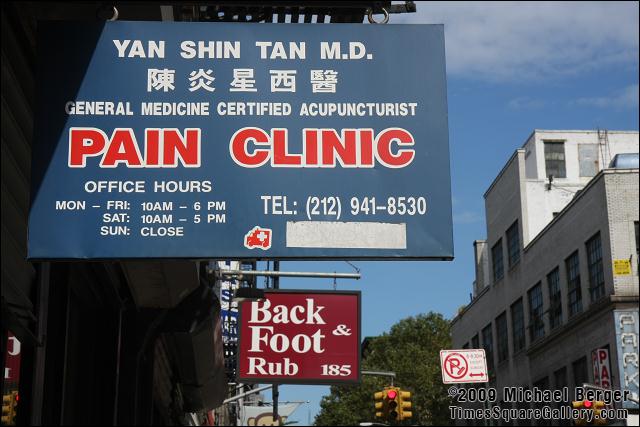 Pain and stress relief offered on Mott Street. Chinatown, NYC.