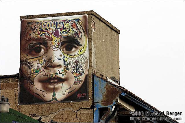 Art on the roof top of Coney Island USA building overlooking amusements and the ocean.