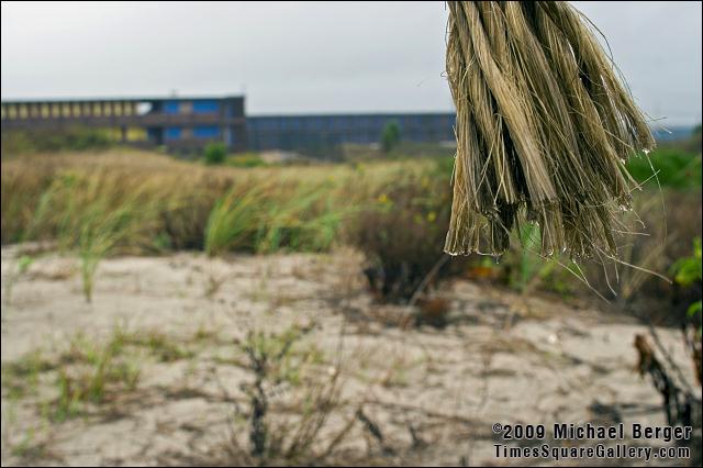 End of trail rope leading to beach with  Surf Club in the distance. Fort Tilden, NY.