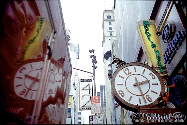 Clock in front of Hilton Hotel on the south side of W. 42nd Street between 7th and 8th Avenue. 2000.