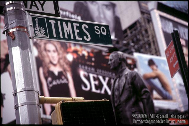 Street sign, billboard, statue at Duffy Square in Times Square. 2001.