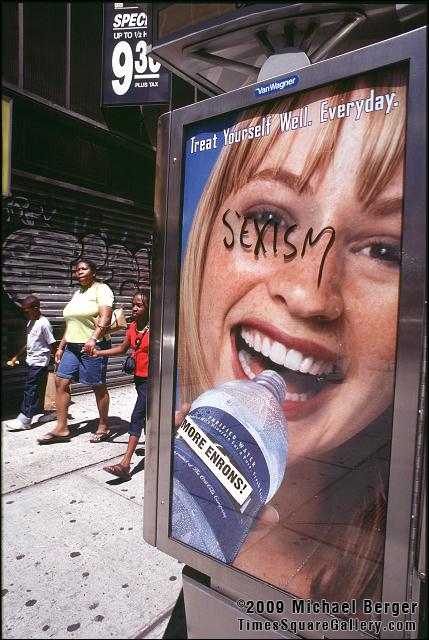 Poster on the side of telephone kiosk in Times Square. 2002.