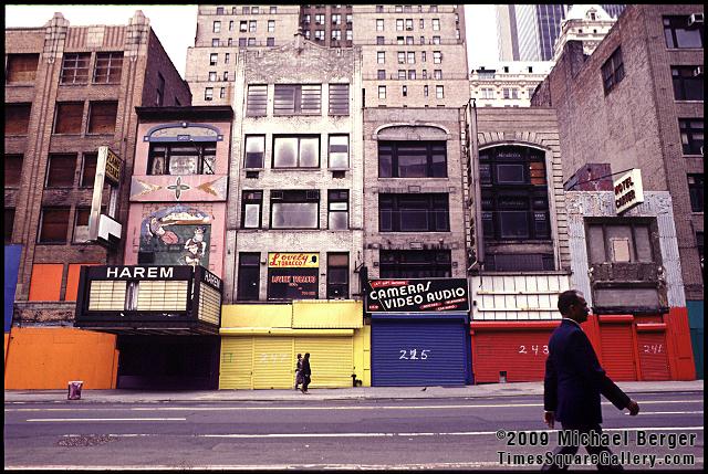 Gated storefronts on the north side of West 42nd Street between 7th and 8th Avenue. 1997.