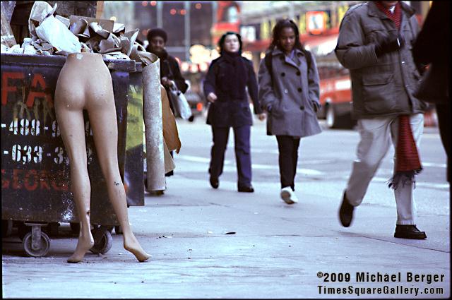 Manequin legs out with the garbage on the north side of West 42nd Street between 7th and 8th Avenue. 1997.