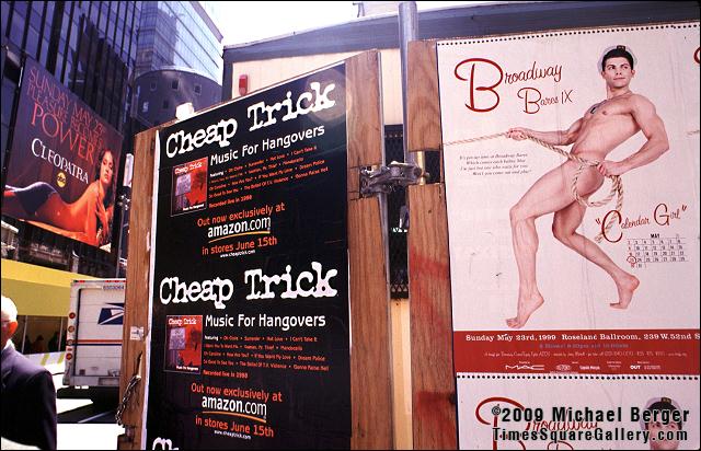 Ads on construction site walls in Times Square. 1999.