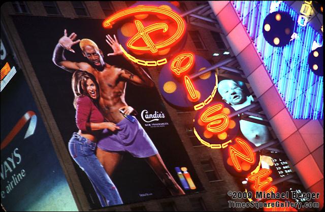 Celebrity fragrance ad featuring Carmen Electra and Dennis Rodman across 7th Avenue from the Disney Store. 1999.